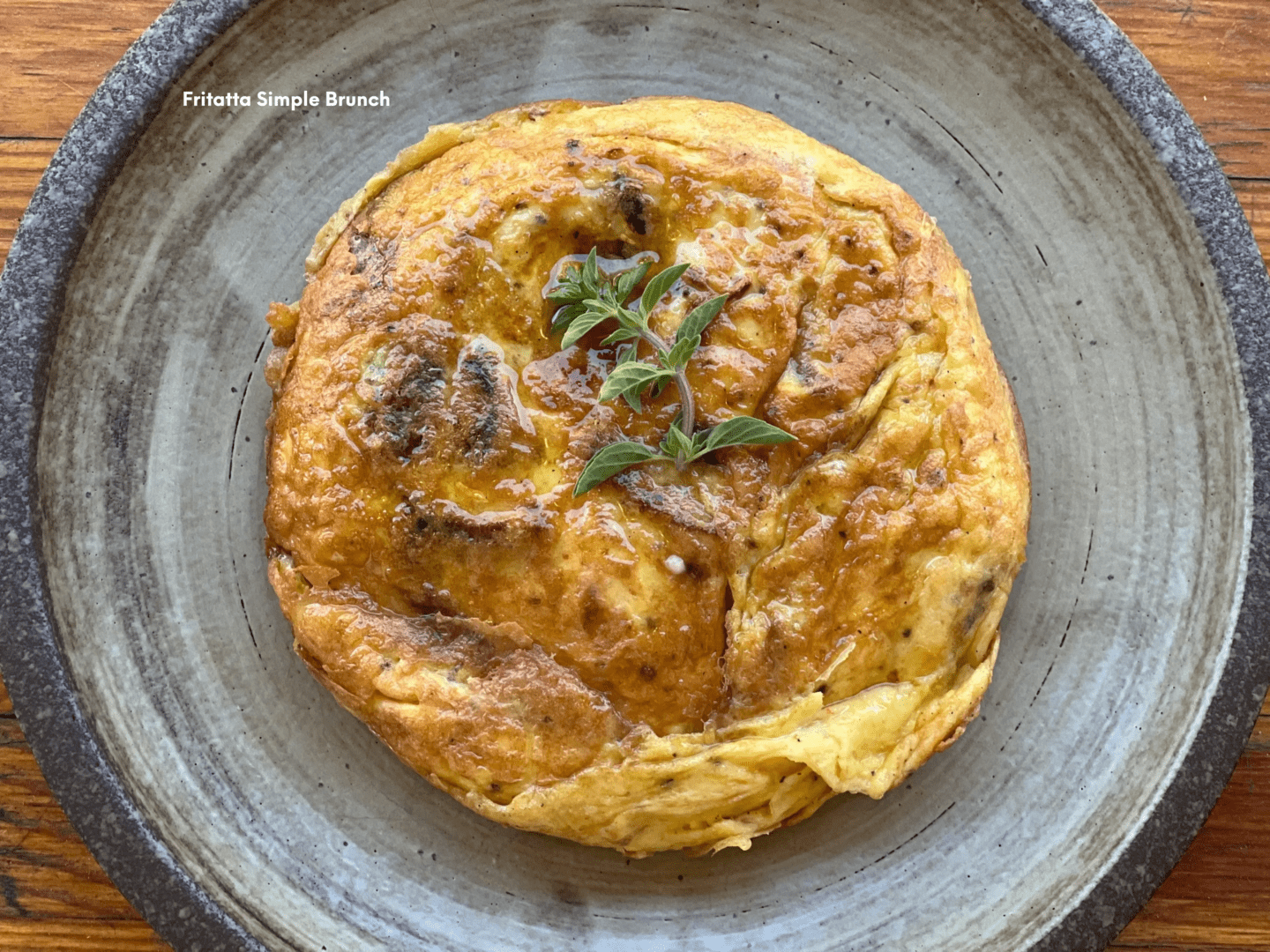 A close up of an omelet on top of a plate.