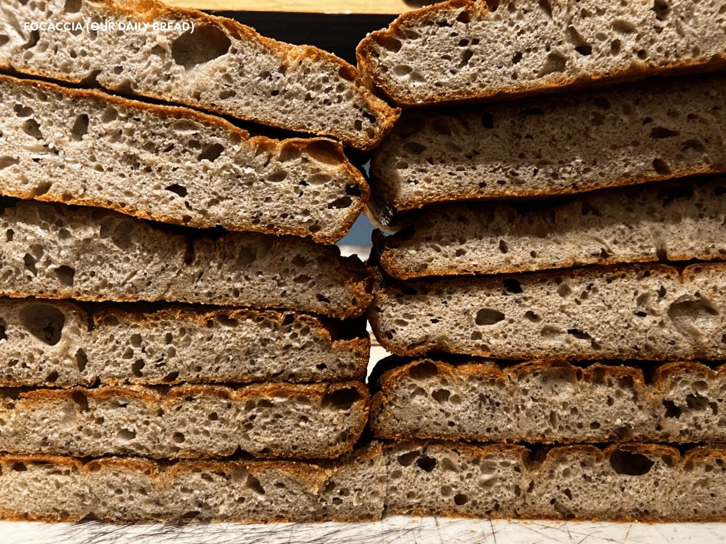 A stack of bread is shown stacked on top of each other.