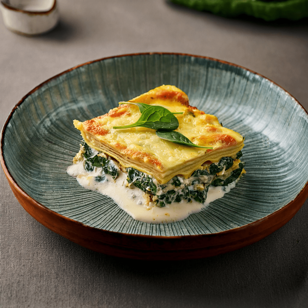 Monk fish lasagna with ricotta cheese and spinach bechamel sauce 