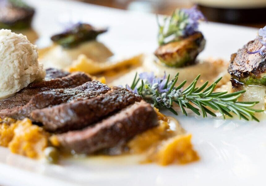 A plate of food with meat and vegetables on it.